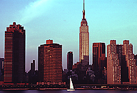 [Golden Empire State Building at Sunrise with Sailboat]