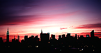 [Silhouetted Skyline Against Red Sky]